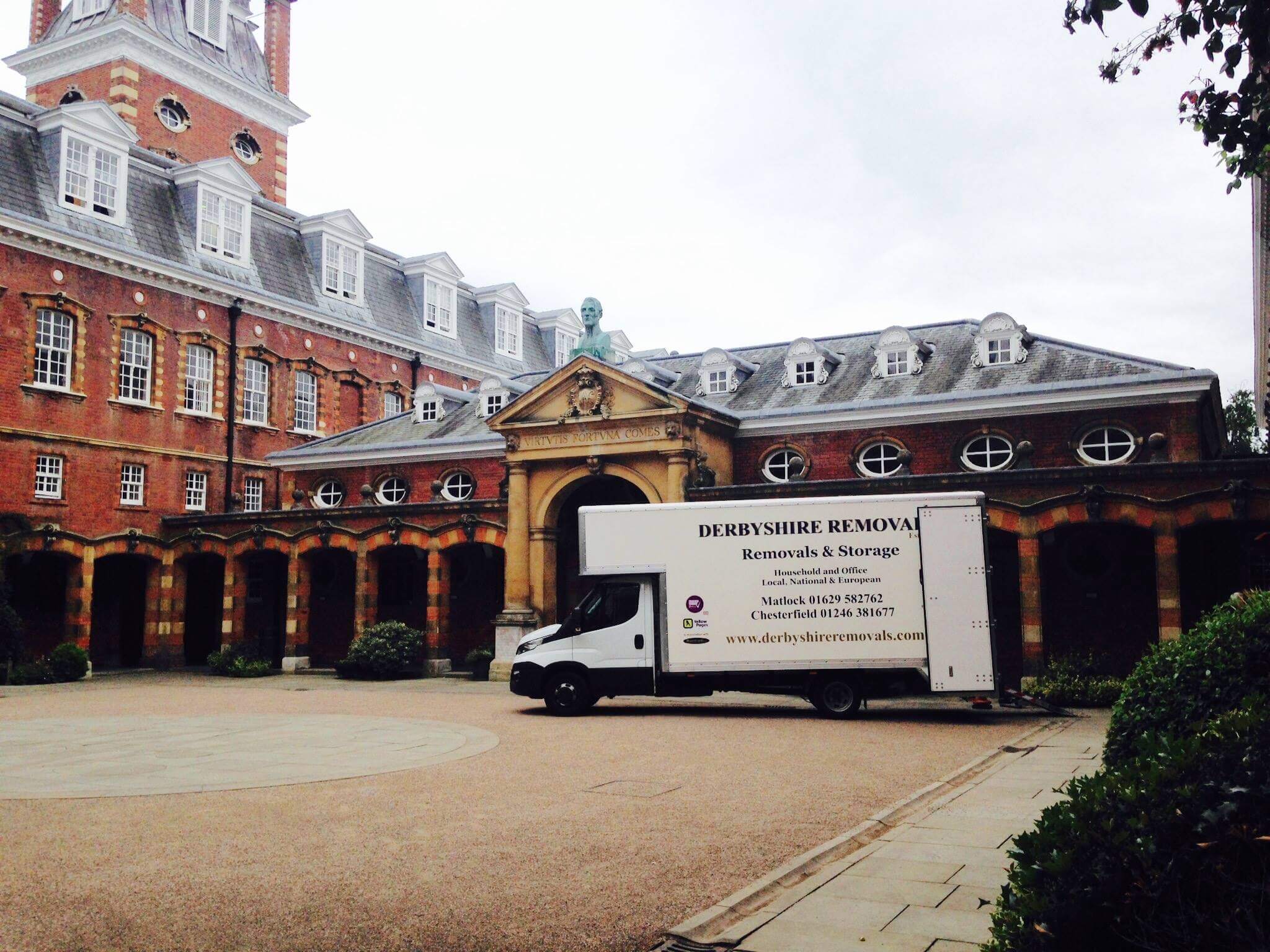 Professional movers carefully loading furniture into a removal van